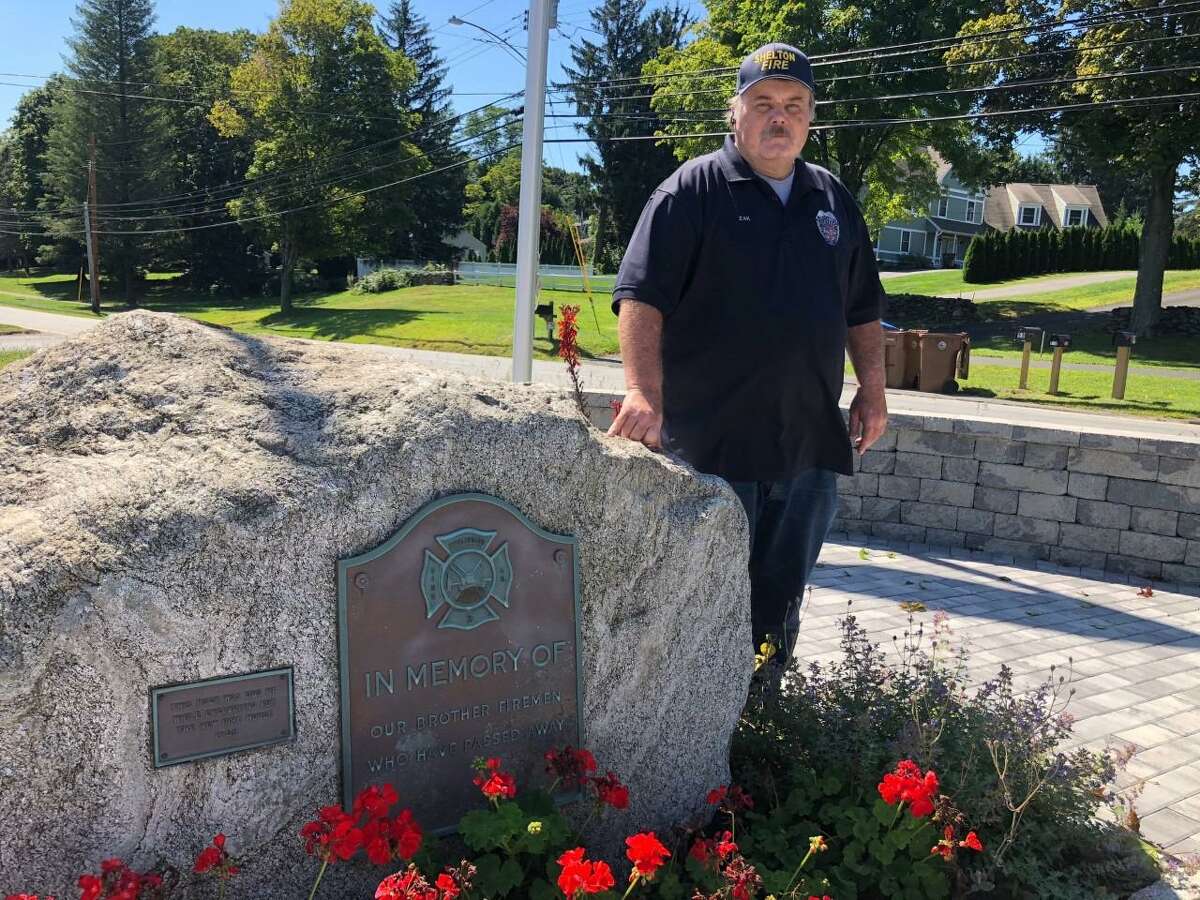 Huntington Fire Co. Capt. Donald Zak at the recently dedicated memorial garden in front of the Huntington Fire Co.