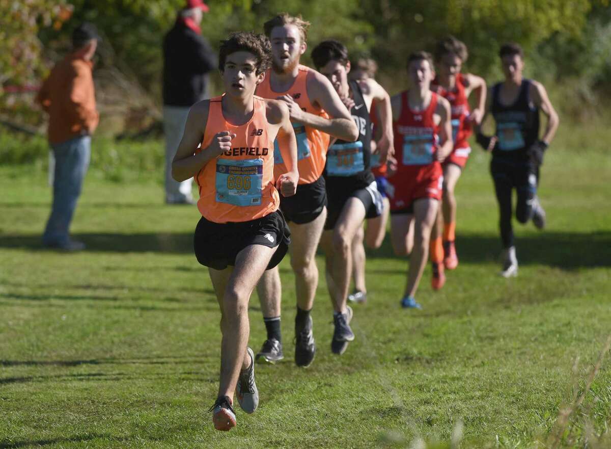 Chuckie Namiot, front, and Ethan MacKenzie, behind Namiot, are the top returning runners for the Ridgefield boys cross country team.