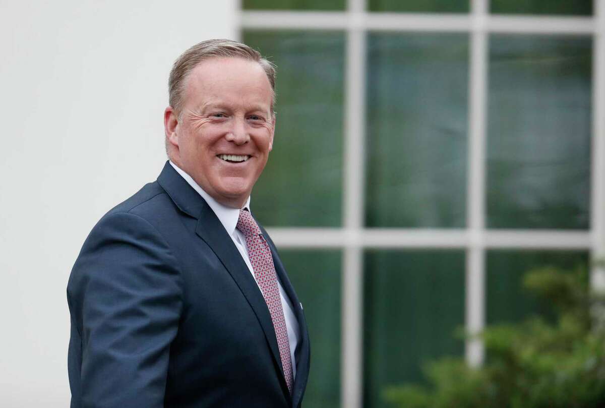 Outgoing White House press secretary Sean Spicer smiles as he departs the White House, Friday, July 21, 2017, in Washington. Spicer will be speaking about his time in the White House on Oct. 16 at a special event at The John Cooper School. (AP Photo/Alex Brandon)