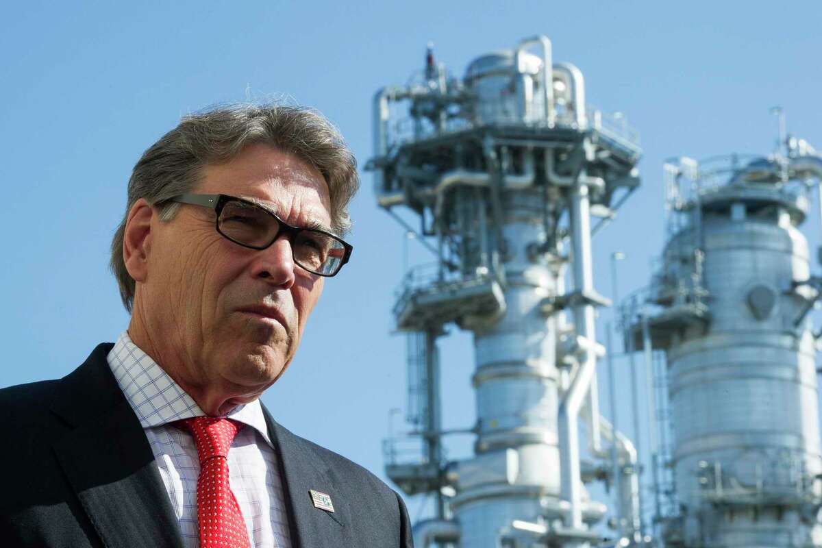 Secretary of Energy Rick Perry stands with the main cyrogenic heat exchange behind him as he speaks with reporters at Dominion Engery's Cove Point LNG liquefaction Project facility in Lusby, Md., Thursday, July 26, 2018. The completion of the facilities export expansion project makes it just the second LNG export facility in the U.S.