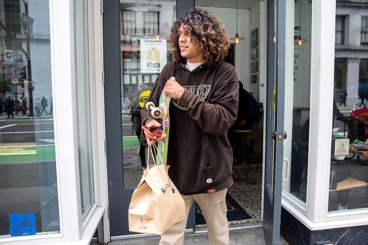 Postmates courier,Tony Martinez, picks up lunch order at Luke's Lobster restaurant. Tuesday, May 21, 2019. San Francisco, Calif.