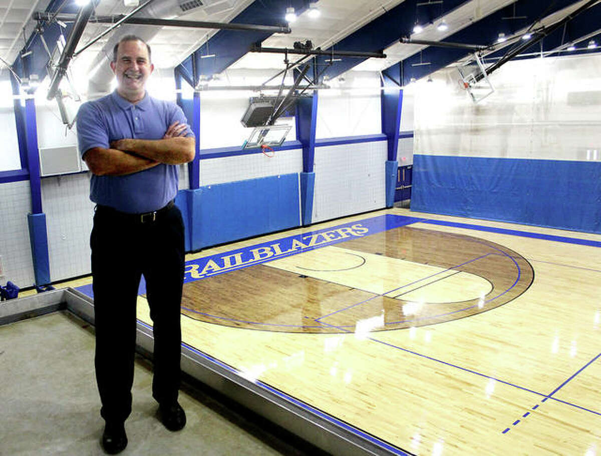 Lewis and Clark Community College athletic director Doug Stotler with the River Bend Arena’s new hardwood basketball/volleyball court in the background. The court is one of many refurbishments at the arena which opened in 1993.