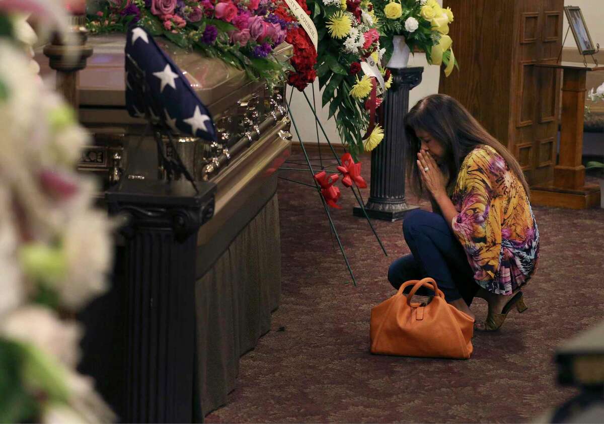 Sandra Torres Richardson kneels to pray by the casket of Lila Cockrell as San Antonians from all walks of life gather for a visitation service at Mission Park Funeral Chapel to pay homage and to celebrate the life of the former mayor on Tuesday, Sept. 3. San Antonio will say a final goodbye Thursday to Lila Cockrell, the city’s first female mayor, during a memorial service and a tribute to her legacy. Both are open to the public.