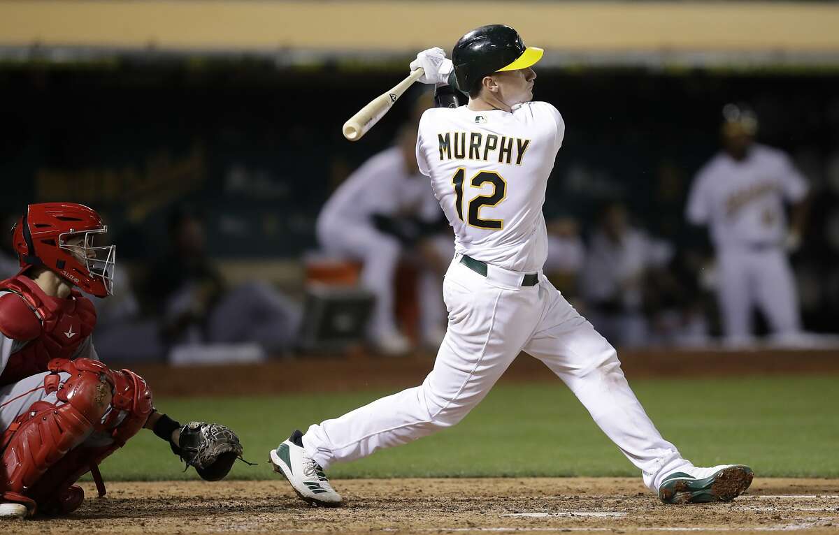 Oakland Athletics' Sean Murphy watches his home run off Los Angeles Angels' Jake Jewell, his first hit in the majors, during the fifth inning of a baseball game Wednesday, Sept. 4, 2019, in Oakland, Calif. (AP Photo/Ben Margot)