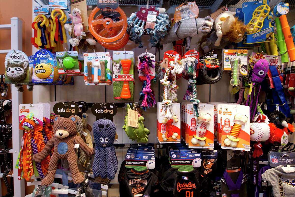 Dog toys are seen at a pet store in Columbia, Md. Pet stores are suing to block a Maryland law that will bar them from selling commercially bred dogs and cats, a measure billed as a check against unlicensed and substandard “puppy mills.”