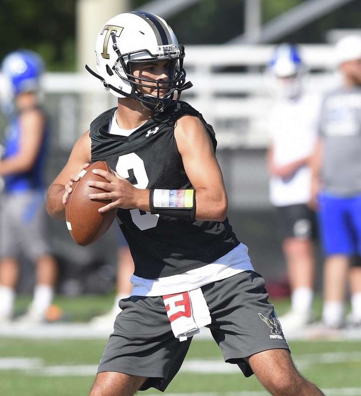 Trumbull quarterback Riley Simpson passes during the annual Rip It and Grip It tournament in summer 7-on-7 football scrimmages at New Canaan High School.