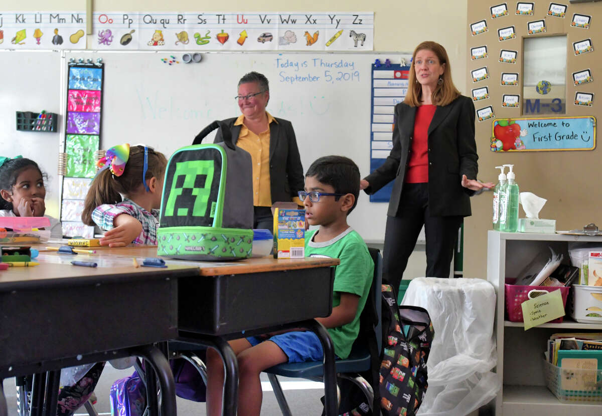 Menands School District Superintendent Maureen Long, left, and New York State acting Education Commissioner Beth Berlin, right, visit students in a first grade class at Menands School on Thursday, Sept. 5, 2019, in Menands, N.Y. (Paul Buckowski/Times Union)