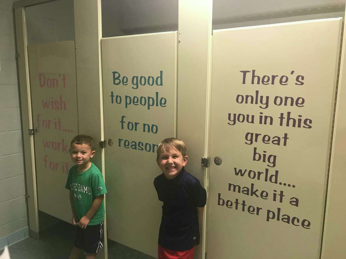 Farmingville bathroom stall quotes promote kindness, positivity