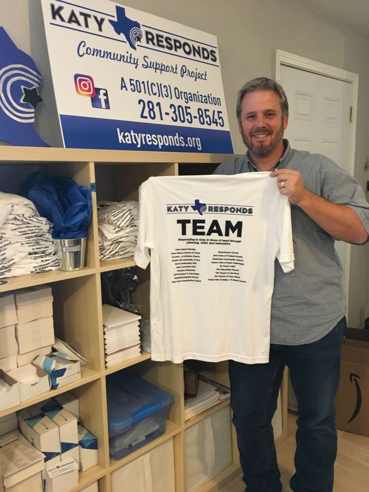 More volunteers are needed by Katy Responds, the nonprofit tasked with helping Katy-area survivors of Hurricane Harvey rebuild their homes and emotional lives. Tom Pretti Jr., chief executive officer/co-founder of Katy Responds, displays T-shirts available to those who step forward to volunteer.