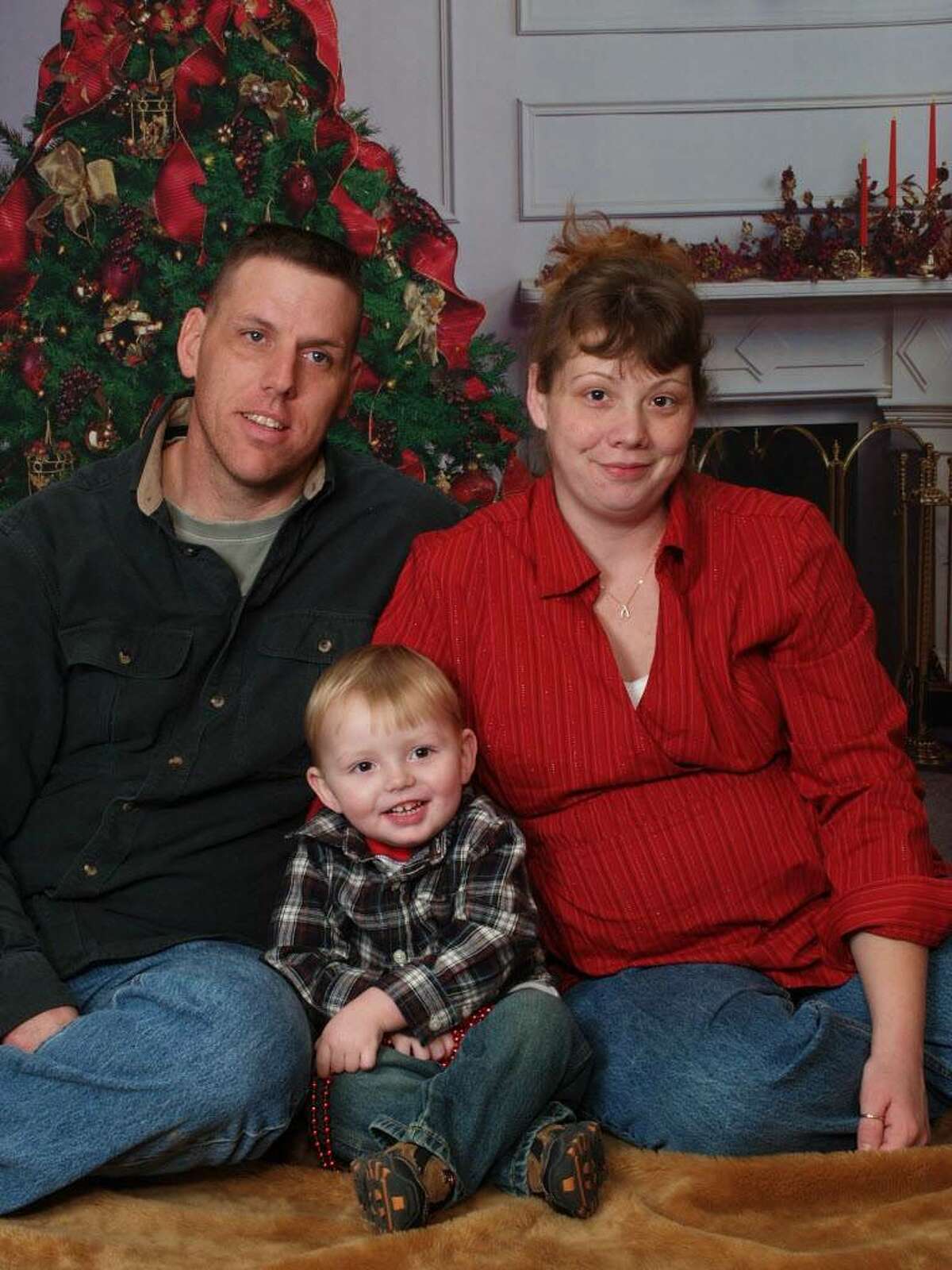 Long-distance trucker Jason Rivenburg of Schoharie County is shown with his wife, Hope, and son Joshua shortly before he was murdered in 2009 while he was parked for the night in his truck in South Carolina. ( Rivenburg family photo )