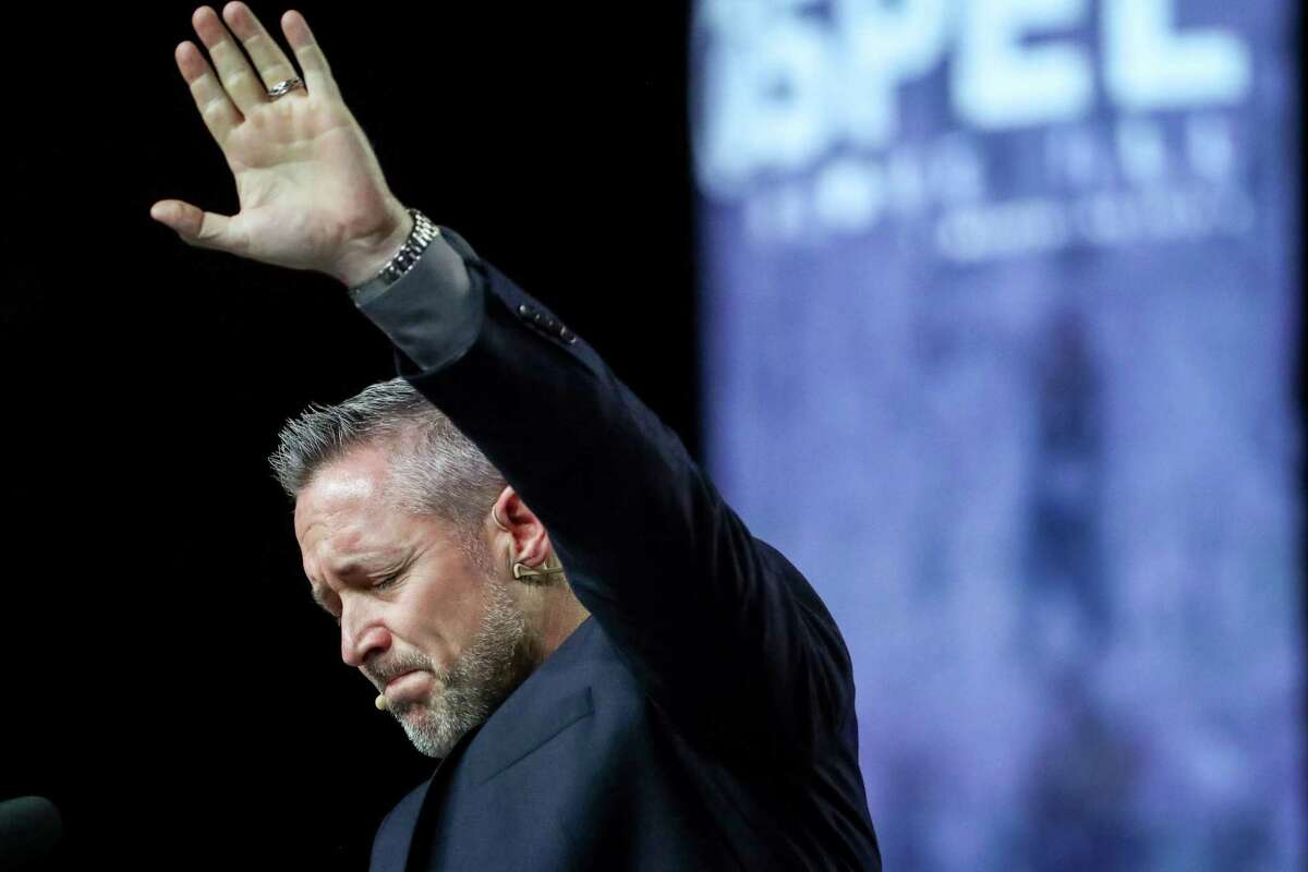 J. D. Greear, president of the Southern Baptist Convention, becomes emotional while talking about sexual abuse within the SBC on the second day of its annual meeting on Wednesday, June 12, 2019, in Birmingham.