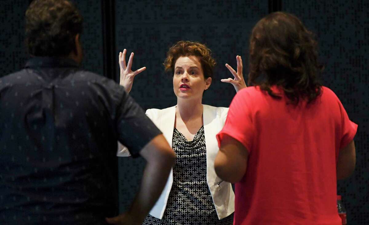 E. Loren Meeker, shown giving notes to Jennifer Rowley and Rafael Davila as they worked on Opera San Antonio’s staging of Puccini's "Tosca" in September, has been named the company’s general director.