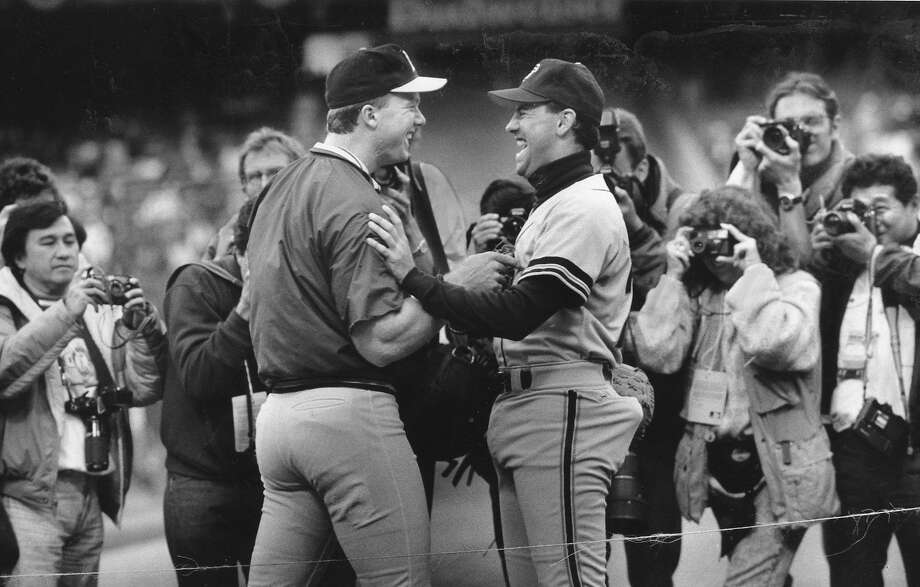 Giants first baseman Will Clark and A's first baseman Mark McGwire greet each other before Game 1 of the 1989 World Series, October 14, 1989  Photo ran 10/16/1989, p. D3 Photo: Deanne Fitzmaurice / The Chronicle 1989