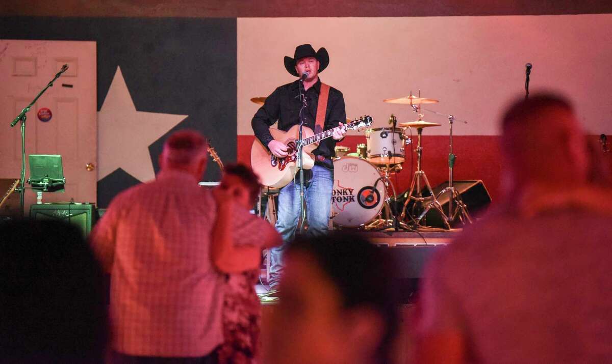 Robert Bumstead, an up-and-coming country musician, plays some songs at the Texas Honky Tonk in Silsbee Saturday night. A native of Kountz, who lives in Groves, Bumstead got the music bug while growing up in Nashville. Photo taken on Saturday. Ryan Welch/The Enterprise