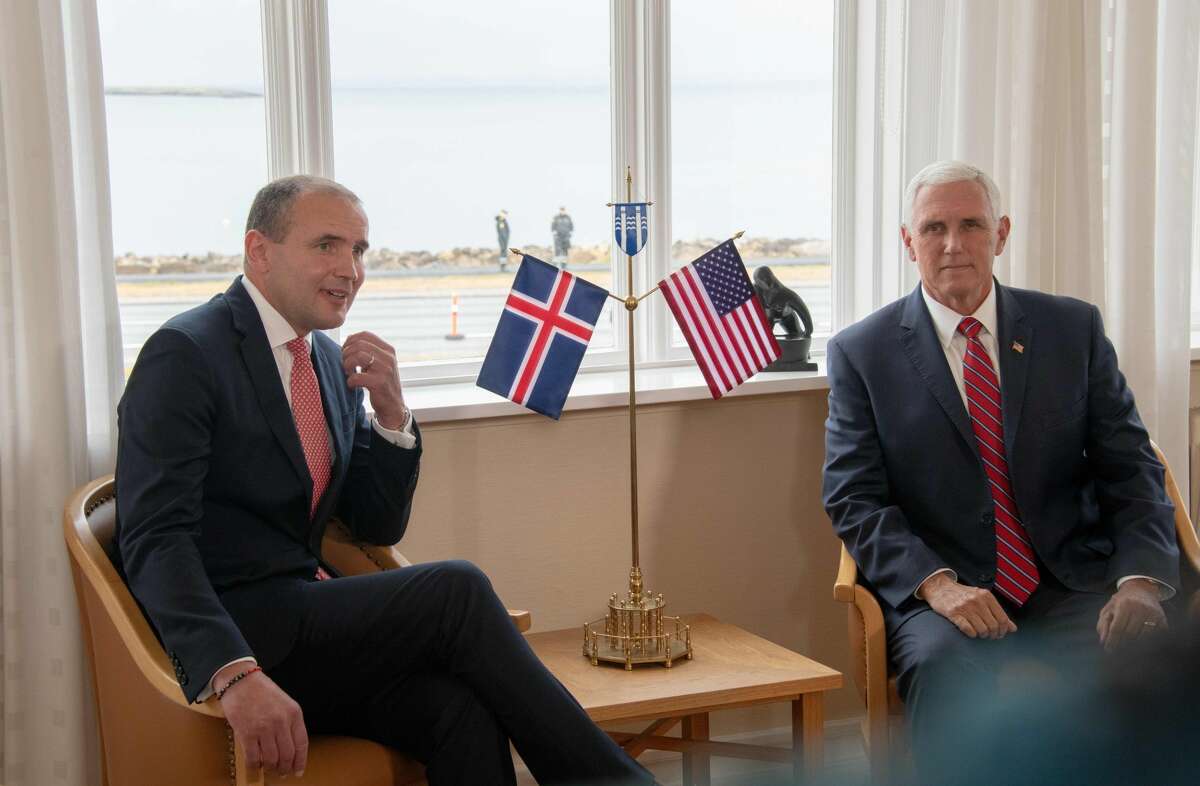 US Vice President Mike Pence (R) meets Iceland's President Gudni Th Johannesson (L) at Hofdi House in Reykjavik on September 4, 2019. - In Iceland, Pence is expected to bring up incursions into the Arctic Circle by China and Russia amid growing tensions in the polar region over melting ice and access to minerals, a White House official has said.