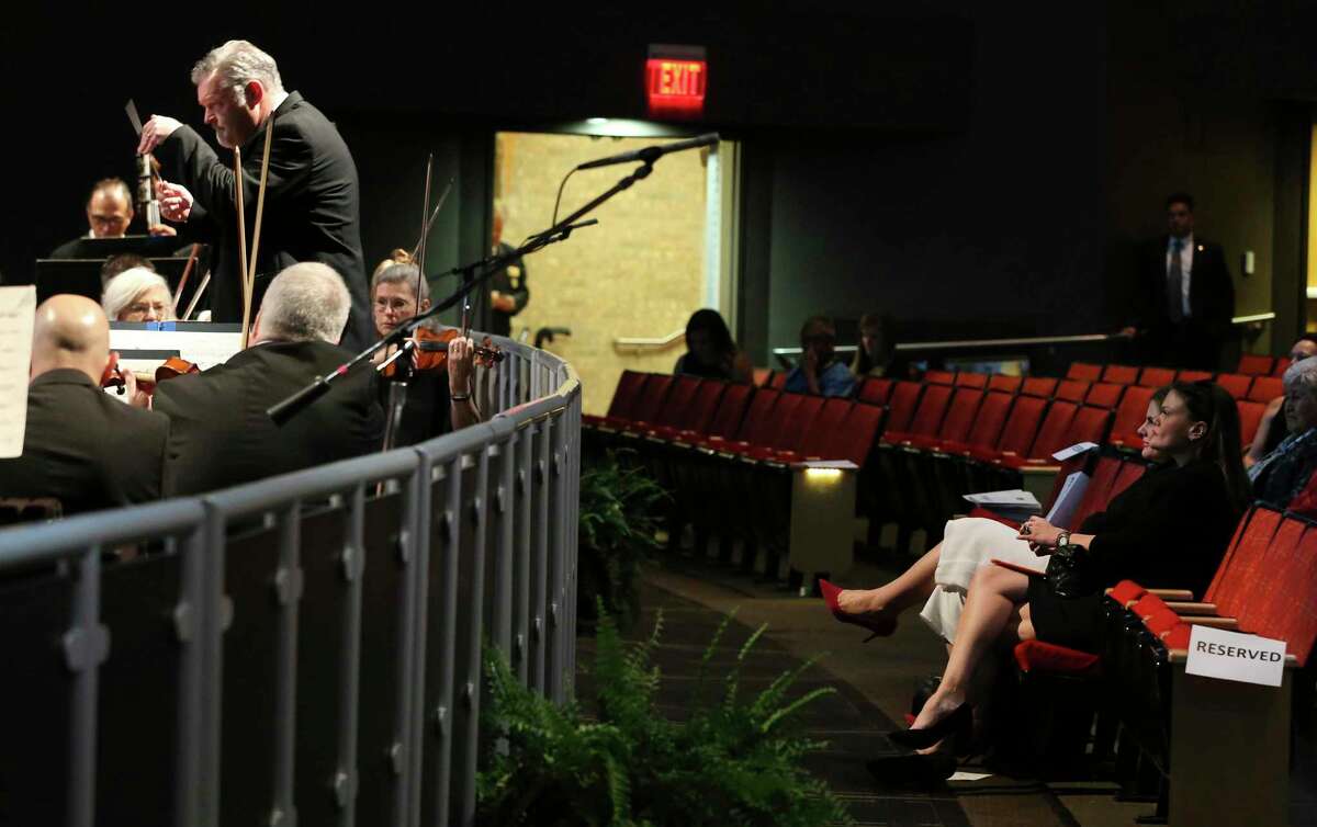 Lila Cockrell’s granddaughter Annalee Gulley, right, watches a performance by the San Antonio Symphony as family, friends and the public attend Thursday’s tribute at the Lila Cockrell Theatre. Though attendance was sparse, dignitaries and the public alike were treated to a walk down memory lane of the influential city leader. Cockrell was 97 years old. (Kin Man Hui/San Antonio Express-News)