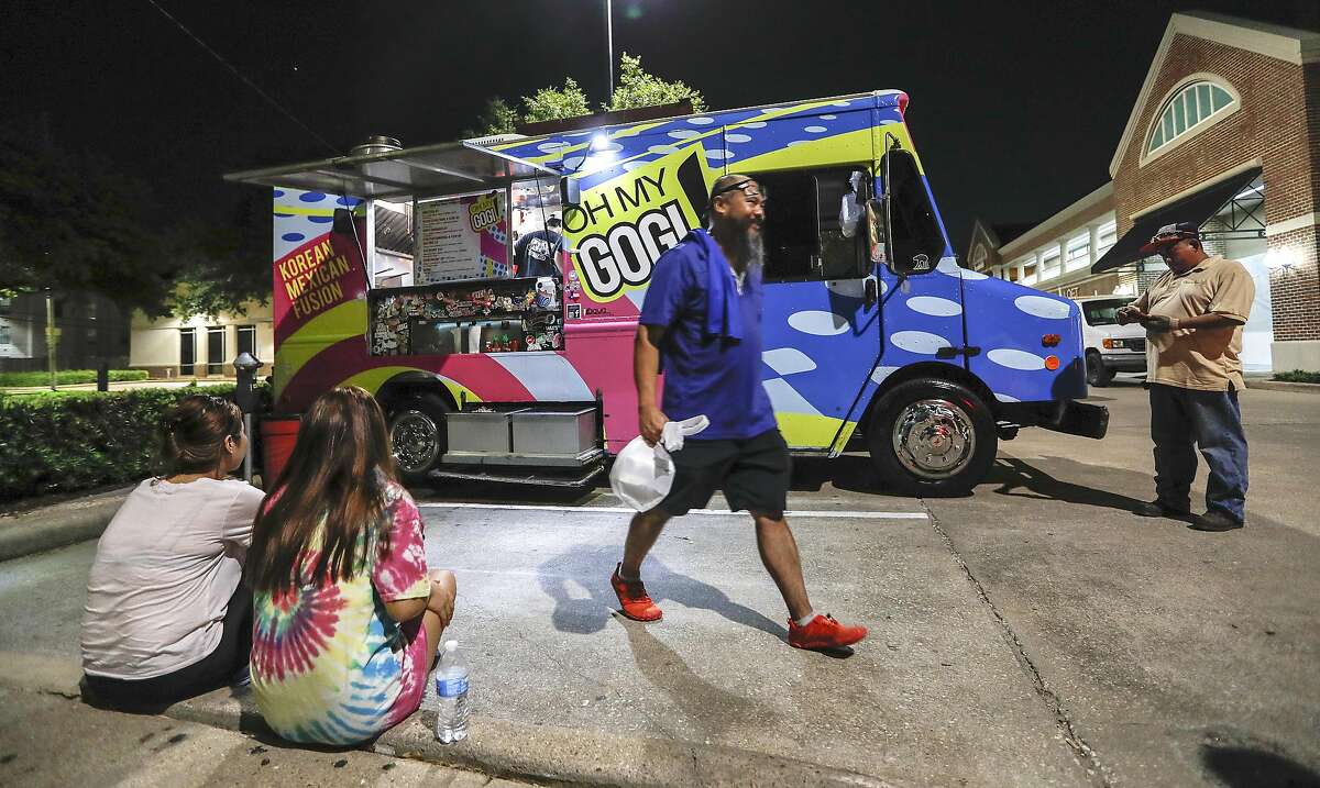 People crowd around the truck as they order and wait for food after, 10pm at Oh My Gogi food truck, 2410 University Blvd, September 4, 2019, in Houston. 