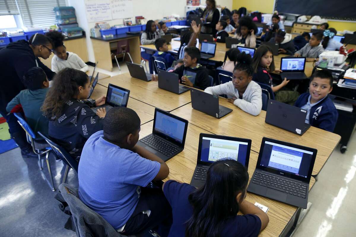 Students in Lynne Martin's 5th grade class study math using Chromebooks at Markham Elementary School in Oakland, Calif. on Thursday, Sept. 5, 2019. The school suffered its second theft of Chromebooks in the past year, with about 64 of the laptops stolen over the Labor Day holiday weekend.