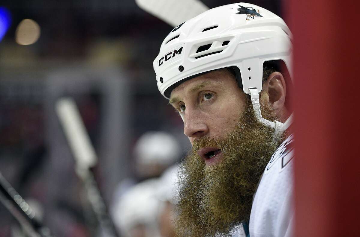 FILE - In this Dec. 4, 2017, file photo, San Jose Sharks center Joe Thornton (19) looks on from the bench during the first period of an NHL hockey game against the Washington Capitals in Washington. Thornton is coming back for another season at age 40, signing a one-year, $2 million contract with the Sharks on Friday, Sept. 6, 2019, after briefly contemplating retirement at the end of this past season. (AP Photo/Nick Wass, File)