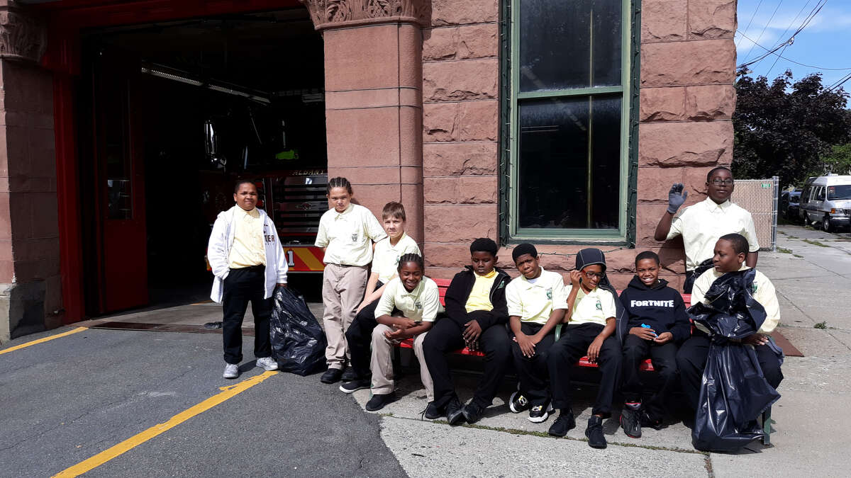 Green Tech High Charter School students do community service in Albany, N.Y. as part of a "Pay it Forward" initiative on Sept. 6, 2019.