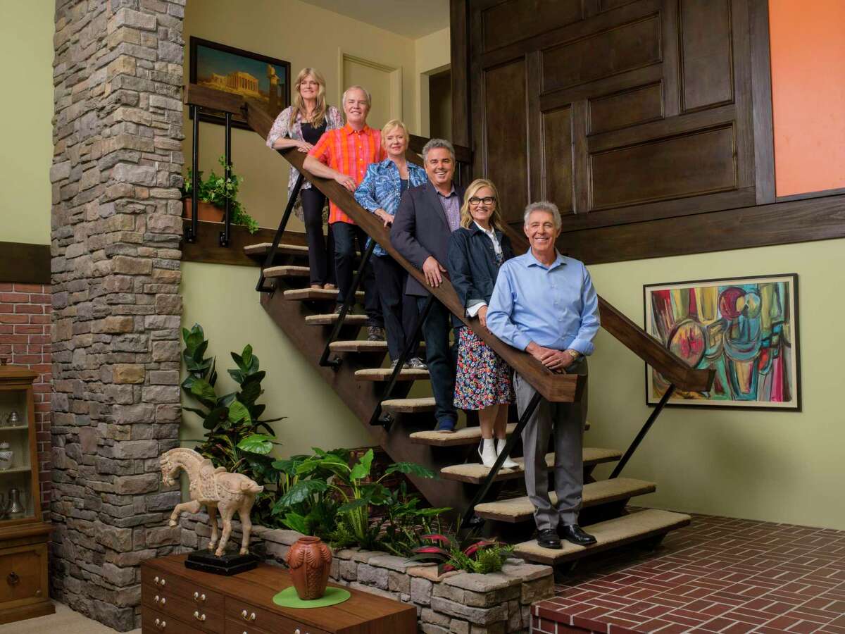 The cast of “The Brady Bunch” — from left, Susan Olsen, Mike Lookinland, Eve Plumb, Christopher Knight, Maureen McCormick, and Barry Williams — joins forces with HGTV stars including Jonathan and Drew Scott for a makeover on the house used for exterior shots in the 1969-74 sitcom. “A Very Brady Renovation,” premieres on HGTV, Sept. 9.