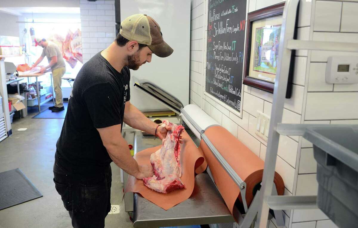 Custon Meats owner Tim Frosina wraps a filet of beef at the shop on Post Road in Fairfield, Conn., on Friday August 30, 2019. This shop specializes in whole animal butchery.