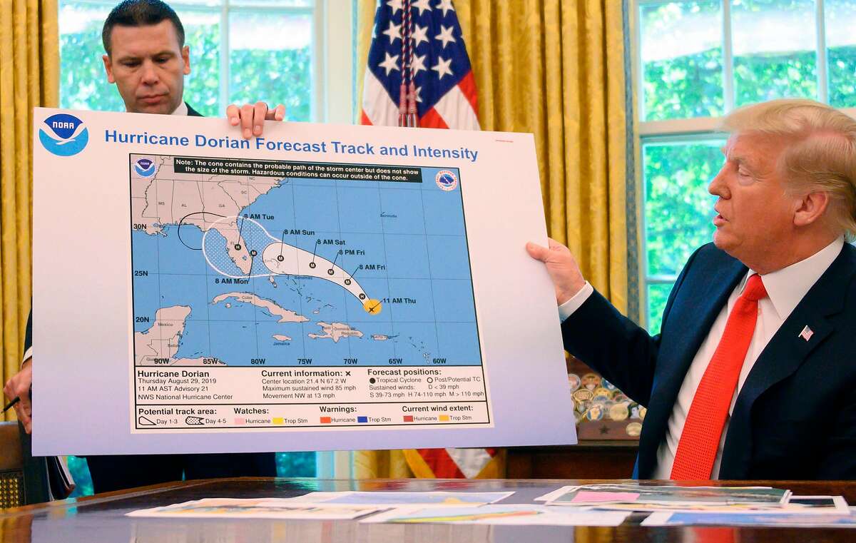 (FILES) In this file photo taken on September 4, 2019, US President Donald Trump and Acting US Secretary of Homeland Security Kevin McAleenan update the media on Hurricane Dorian preparedness from the Oval Office at the White House in Washington, DC. - Six days and President Donald Trump is still trying to persuade the world he was right about Hurricane Dorian hitting Alabama. He has insisted via Twitter to his more than 60 million followers. He has brandished a mysteriously-altered weather map in the Oval Office. He has deployed a rear admiral. (Photo by JIM WATSON / AFP)JIM WATSON/AFP/Getty Images