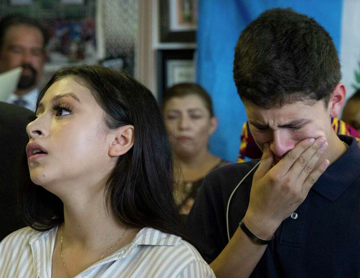 Tears run down Roland Gramajo Jr.'s cheek while his sister, Katherine Gramajo, 18, is talking about their father, Roland Gramajo, who is being detained at a detention facility in Conroe, during a press conference on Friday, Sept. 6, 2019, in Houston. The 40-year-old was arrested by U.S. Immigration and Customs Enforcement while going to work on Thursday. Gramajo, a Guatemala native, has five U.S. citizen children and a legal resident wife.