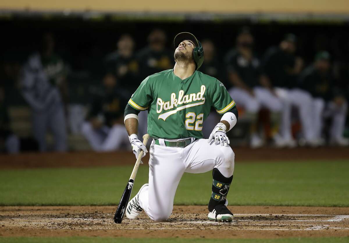 Oakland Athletics' Ramon Laureano eyes a pop up hit against the Detroit Tigers during a baseball game Friday, Sept. 6, 2019, in Oakland, Calif. (AP Photo/Ben Margot)