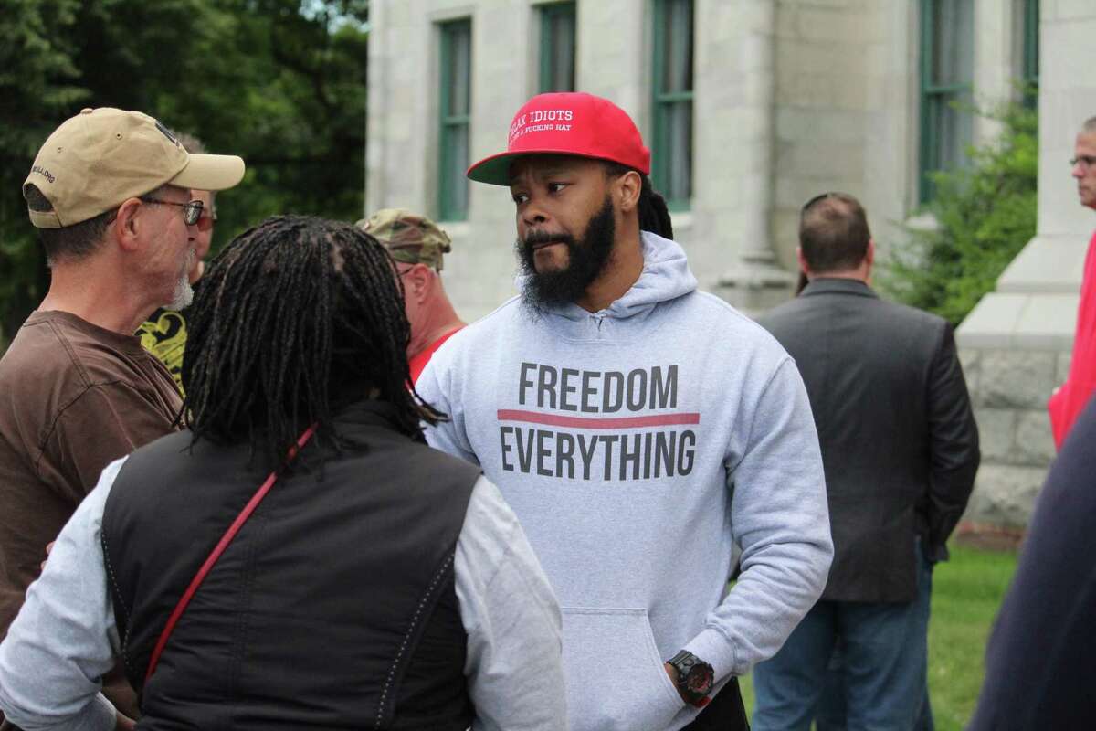 The Connecticut Citizens Defense League organized a gun rights rally at the state Capitol in Hartford on Saturday opposing gun control measures proposed in Congress. Above, keynote speaker Maj Toure, founder of Black Guns Matter, from Phildelphia, talking with fellow rallyers after he spoke.