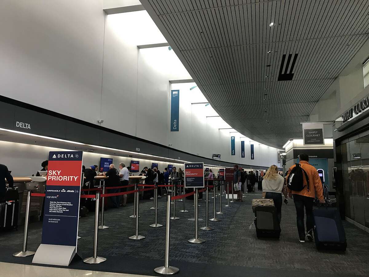 Travelers walk through the ticketing section of Terminal 1 at San Francisco International Airport on�Saturday, Sept. 7, 2019. Saturday marked the start of construction on the airport's busiest runway section, which delayed 160 flights, canceled 89 flights, and caused snaking lines of restless travelers.