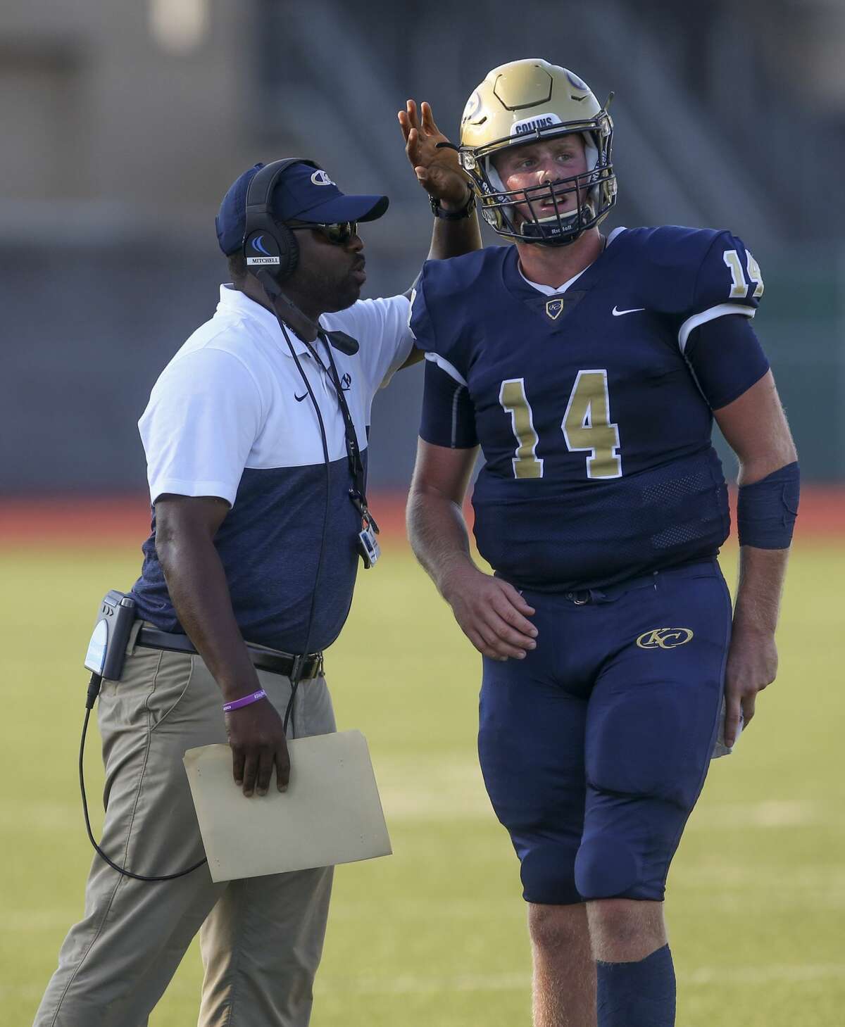USA: TX: Spring: Klein Collins head football coach Adrian Mitchell talks to quarterback Colby Powers (14) while playing against Clear Springs in the second quarter at Memorial Stadium on September 7, 2019 in Spring, TX.