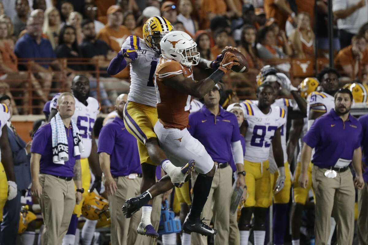 Texas wide receiver Brennan Eagles (13) makes a catch in front of LSU cornerback Kristian Fulton (1) during the second half of an NCAA college football game Saturday, Sept. 7, 2019, in Austin, Texas. (AP Photo/Eric Gay)