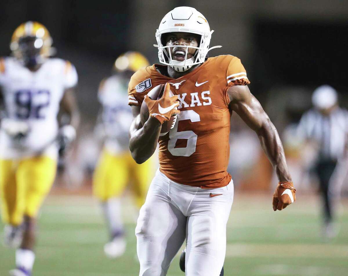Devin Duvernay gets a straigtaway sprint to the goal line for a fourth quarter touchdown as Texas hosts LSU at Darrell K. Royal Stadium on September 7, 2019.