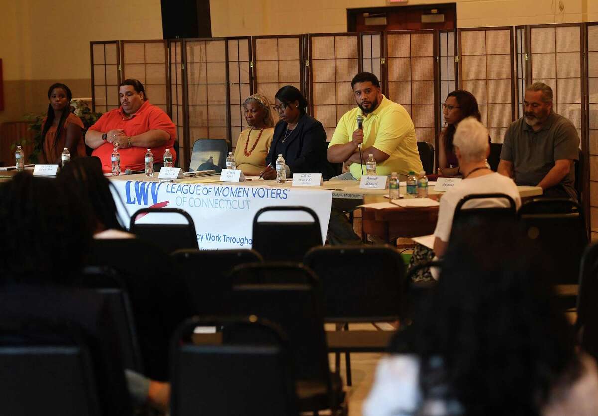 From left; Candidates in the primaries for Bridgeport Board of Education Democrats Bobbi Brown, Albert Benejan, Sybil Allen, Dasha Spell, Eric Alicea, and Amina Brown and Republican Chris Genduso debate at The Bessemer Center in Bridgeport Conn. on Tuesday, September 3, 2019.