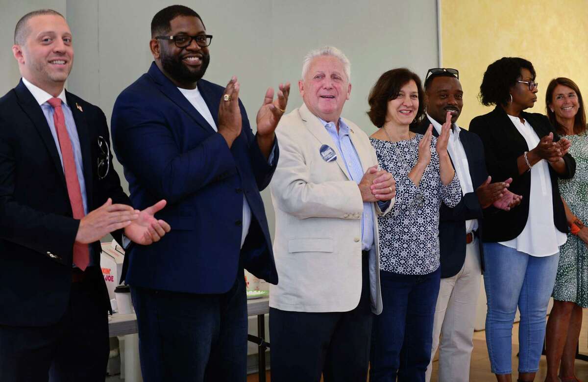 Norwalk Mayor Harry Rilling, center, celebrates the kick off his campaign with Common Council candidates Saturday, September 7, 2019, at the Norwalk DTC campaign headquarters on North Main Street in Norwalk, Conn. He was joined by local, state and federal officials, including Congressman Jim Himes.