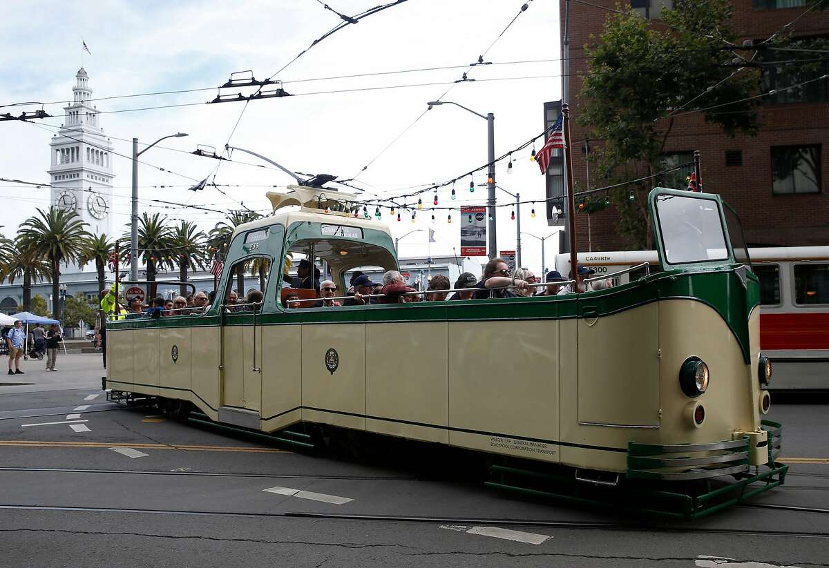 The popular 1934 Blackpool Boat Tram takes visitors for a free ride on the Embarcadero at the Muni Heritage Weekend celebration of historic streetcars and buses in San Francisco, Calif. on Saturday, Sept. 7, 2019.
