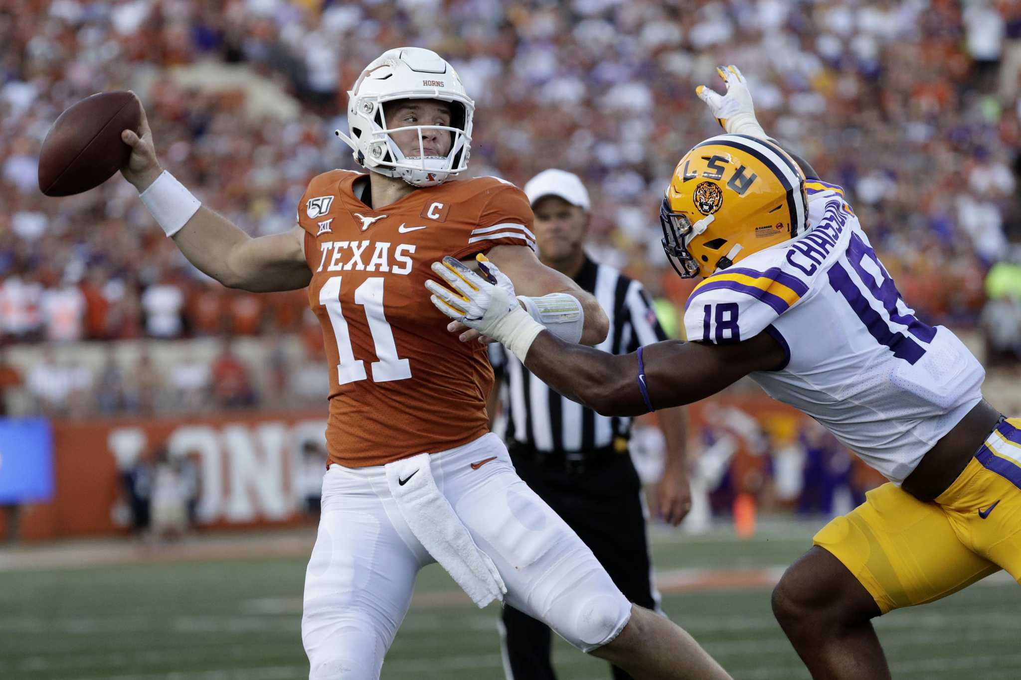 LSU quarterback Joe Burrow (9) celebrates after connecting with wide  receiver Justin Jefferson for a touchdown against Texas during the second  half of an NCAA college football game Saturday, Sept. 7, 2019