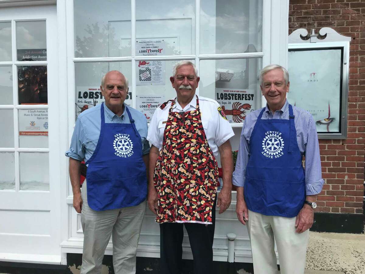 Rotary Club of New Canaan Lobsterfest Committee members Keith Simpson, Fred Baker and Scott Cluett, promote the Sept. 20-21 event at a display at the New Canaan Playhouse.