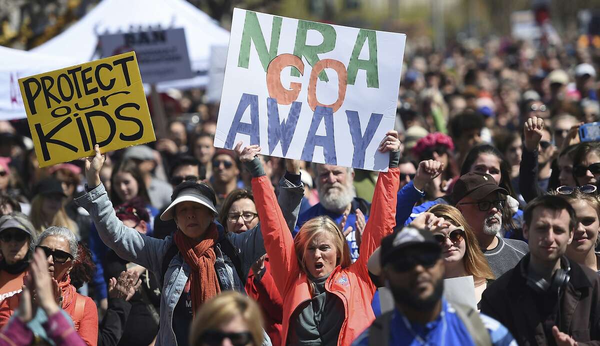 FILE - In this March 24, 2018, file photo, crowds of people participate in the March for Our Lives rally in support of gun control in San Francisco. The National Rifle Association sued San Francisco on Monday, Sept. 9, 2019, over the city's recent declaration that the gun-rights lobby is a "domestic terrorist organization." (AP Photo/Josh Edelson, File)