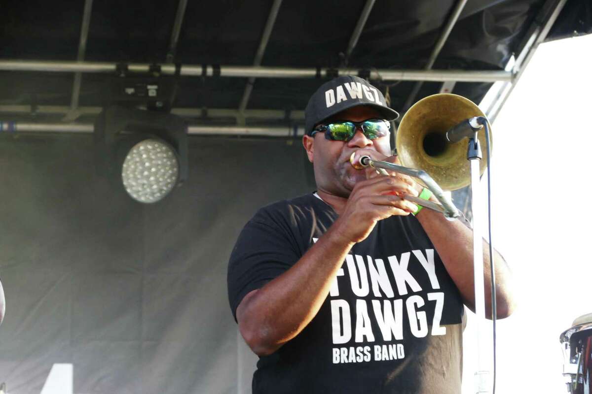 The Funky Dawgz treated New Canaan to music in New Orleans' tradition as Marvin McNeil played his trombone at the Fieldfest.
