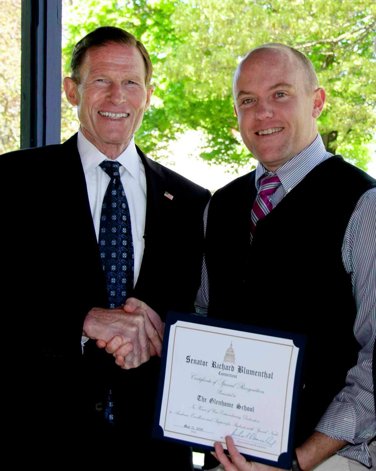 The Glenholme School in Washington was recently awarded a certificate of recognition for excellence in the field of special education by U.S. Sen. Richard Blumenthal. Above, Glenholme School Executive Director Noah Noyes, right, accepts the award on behalf of the school community.