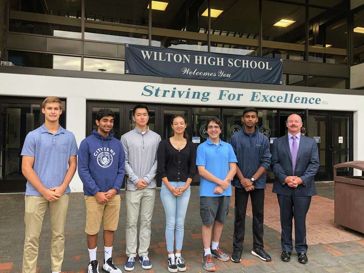 National Merit finalists, from left, Maden Herve, Rishabh Raniwala, Jeffrey Huang, Ashleigh Coltman, Alexander Koutsoukos, Vignesh Subramanian stand with Wilton High School Principal Dr. Robert. W. O'Donnell when they were named semifinalists in September.