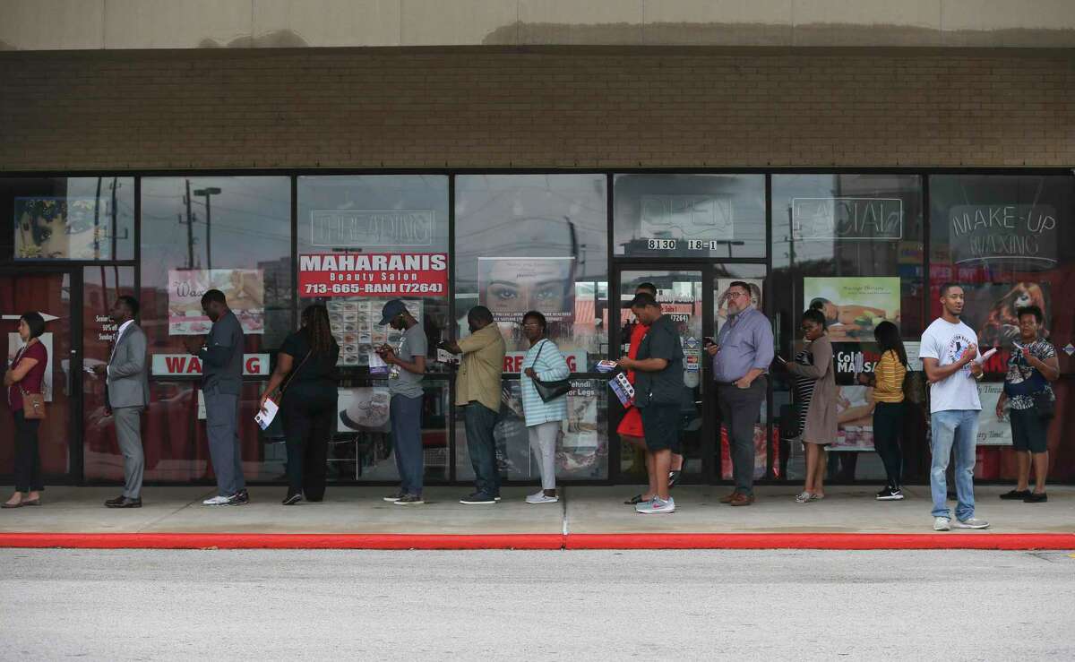 Voters wait in the line to vote at the Fiesta Mart on Kirby Drive and Old Spanish Trail on Election Day on Tuesday, Nov. 6, 2018, in Houston.