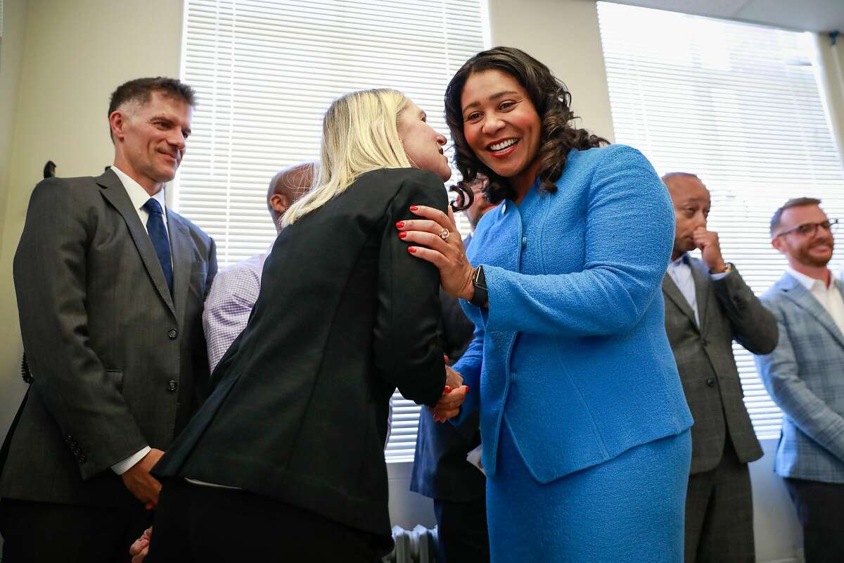 Mayor London Breed listens to Dr. Diane Havlir (left) after a press conference regarding the city's annual report on HIV and AIDS at Zuckerberg San Francisco Hospital in San Francisco, California, on Tuesday, Sept. 10, 2019. The report noted that approximately 200 people were infected in the city this year.