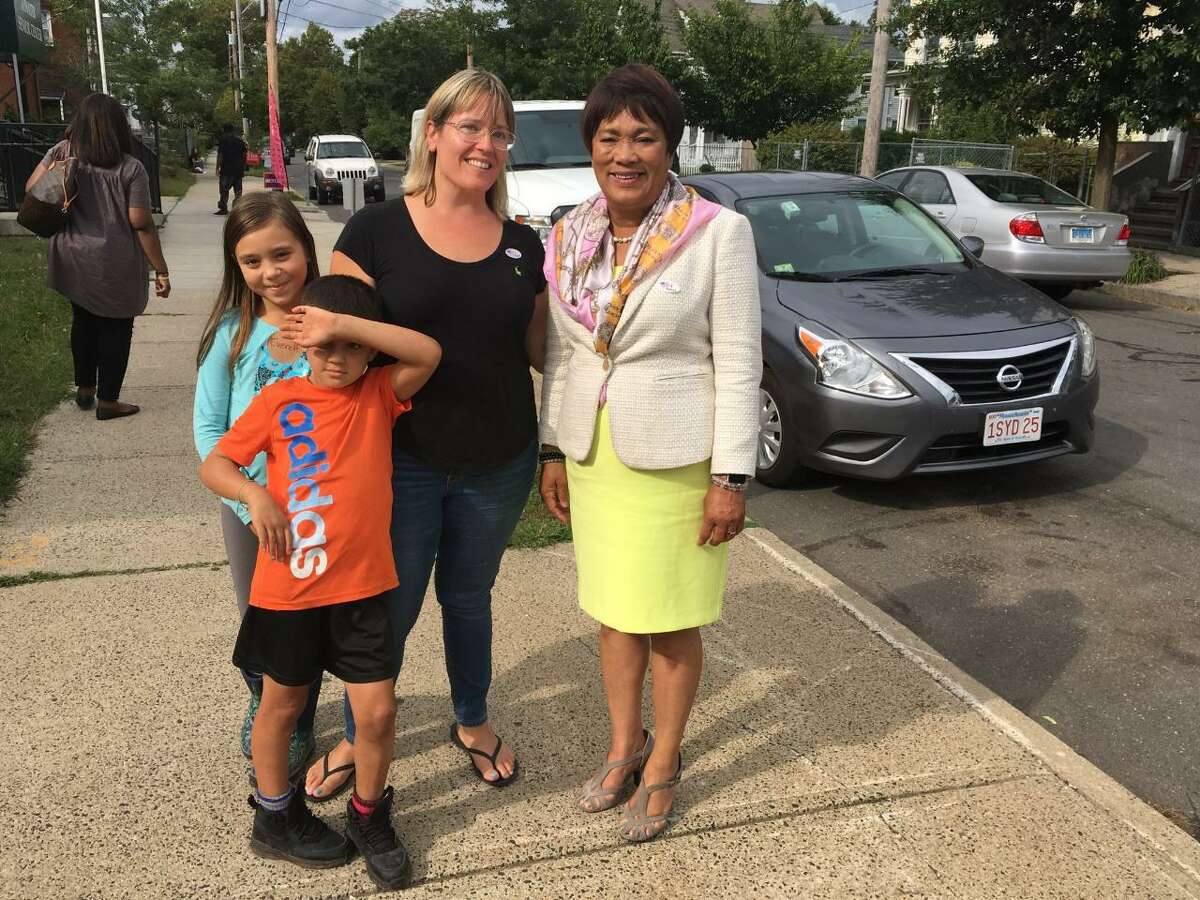 Mayor Toni Harp at the polls in Ward 14 with Jessica Holmes and her children.