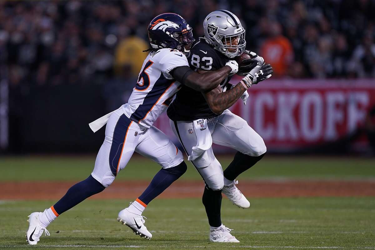 Oakland Raiders tight end Darren Waller runs the ball during an NFL  football game against the D …