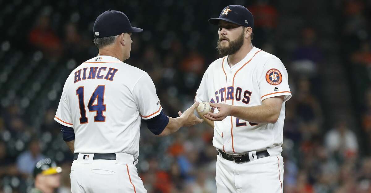 Houston Astros starting pitcher Wade Miley (20) gets pulled by manager AJ Hinch during the first inning of a MLB baseball game at Minute Maid Park, Tuesday, Sept. 10, 2019, in Houston.