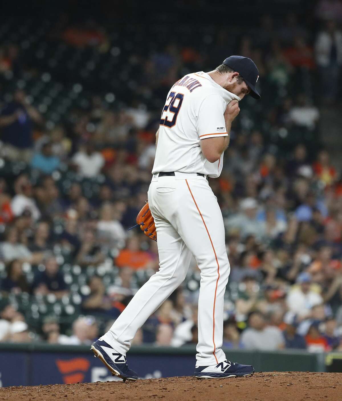 Houston Astros relief pitcher Joe Biagini (29) reacts after giving up a two-run home run to Oakland Athletics Marcus Semien during the fourth inning of a MLB baseball game at Minute Maid Park, Tuesday, Sept. 10, 2019, in Houston.