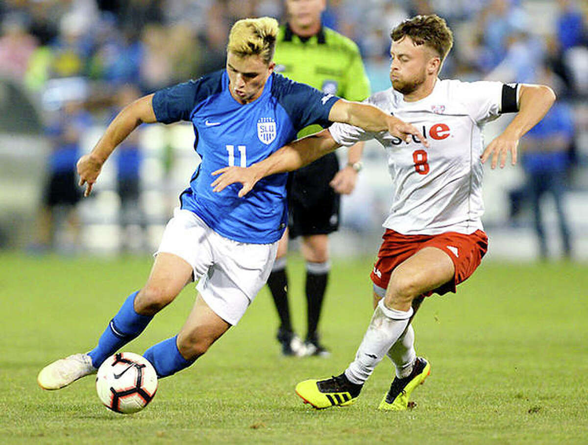 Leo Novaes of Saint Louis University (11) tries to move past SIUE’s Keegan McHugh during last year’s Bronze Boot soccer game at Hermann Stadium in St. Louis. The teams tied 1-1. This season’s Bronze Boot game is set for 7:30 Friday at SIUE’s Korte Stadium.